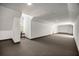 Large bonus room with a window and neutral carpet, offering versatile space at 4940 E Fort King St, Ocala, FL 34470