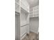 Walk-in closet featuring custom shelving and ample hanging space at 4940 E Fort King St, Ocala, FL 34470