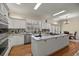 Bright open kitchen with an island cooktop, lots of storage, and stainless steel appliances at 4940 E Fort King St, Ocala, FL 34470