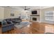 The living room features a stone fireplace, wood floors, and neutral walls at 4940 E Fort King St, Ocala, FL 34470