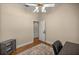 Bright home office with a fan, hardwood floors, and convenient desk at 4940 E Fort King St, Ocala, FL 34470