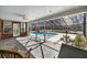 Covered patio with view of enclosed outdoor pool area at 4940 E Fort King St, Ocala, FL 34470