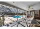 Screened patio with a pool and hot tub, perfect for relaxing and entertaining outdoors at 4940 E Fort King St, Ocala, FL 34470