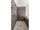 Shower with multiple shower heads and mosaic tile floor at 4940 E Fort King St, Ocala, FL 34470