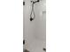 Modern shower featuring white subway tile, black hardware, and a shower niche for storage at 4940 E Fort King St, Ocala, FL 34470