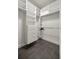 White walk-in closet features shelving and a hanging rod at 4940 E Fort King St, Ocala, FL 34470