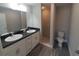 Bathroom featuring a double sink vanity, granite countertops, and a separate walk-in shower at 1 Fisher Lane Way, Ocklawaha, FL 32179