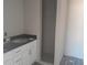 Bathroom featuring a sleek vanity with dual sinks and a modern walk-in shower, designed for convenience at 1 Fisher Lane Way, Ocklawaha, FL 32179