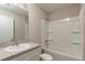 Clean bathroom featuring a shower-tub combo with white tile and a simple vanity with sink at 1 Fisher Lane Way, Ocklawaha, FL 32179