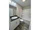 Modern bathroom with a sleek vanity, integrated sink, and bathtub, offering a practical and stylish space at 1 Fisher Lane Way, Ocklawaha, FL 32179