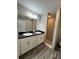 Well-lit bathroom featuring double vanity sinks, with granite countertops, and a tile shower for a luxurious feel at 1 Fisher Lane Way, Ocklawaha, FL 32179