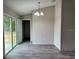Light filled dining room with new light fixture, with easy access to the patio and backyard at 1 Fisher Lane Way, Ocklawaha, FL 32179