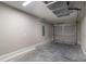 Clean garage with a painted floor and walls, ready for parking and extra storage at 1 Fisher Lane Way, Ocklawaha, FL 32179