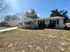 Charming home featuring a well-kept lawn and inviting curb appeal on a sunny day at 10824 Sw 90Th Ter, Ocala, FL 34481