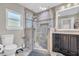 Modern bathroom featuring a tiled glass shower, vanity with sink, and tile flooring at 11619 Lane Park Rd, Tavares, FL 32778