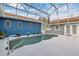 Enclosed pool area showcasing a uniquely designed pool, hot tub, and entertainment space at 11619 Lane Park Rd, Tavares, FL 32778