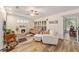 Comfortable living room with fireplace, neutral color palette, and wood-look flooring at 11725 79Th Cir, Ocala, FL 34476