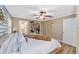 Bright main bedroom offers walk-in closet, ensuite, and a cozy decor with neutral paint tones at 11725 79Th Cir, Ocala, FL 34476