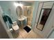 Cozy bathroom featuring a pedestal sink, and a glass doored shower, and bright lighting at 130 Harbour Cove Way, Clermont, FL 34711