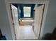 Luxurious bathroom with garden tub, tile surround, and large window bringing in natural light at 130 Harbour Cove Way, Clermont, FL 34711