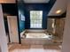 Elegant bathroom featuring a garden tub, walk-in shower with glass door, and bright blue walls at 130 Harbour Cove Way, Clermont, FL 34711