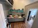 Upstairs bonus room has vinyl floors and an attached closet room with a mirror at 130 Harbour Cove Way, Clermont, FL 34711