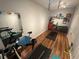 Well-equipped home gym featuring weights, a treadmill, a bike, and rubber flooring at 130 Harbour Cove Way, Clermont, FL 34711