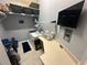 Functional laundry room with washer, dryer, folding counter, and storage shelves at 130 Harbour Cove Way, Clermont, FL 34711
