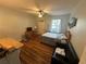 Efficient studio space with wood flooring, a queen bed, and seating area at 130 Harbour Cove Way, Clermont, FL 34711