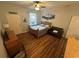 Efficient studio space with wood flooring, a queen bed, and seating area at 130 Harbour Cove Way, Clermont, FL 34711