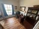 Functional home office with a large window, built-in bookshelves, and an executive desk setup at 130 Harbour Cove Way, Clermont, FL 34711