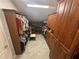 Spacious walk-in closet features custom built-in shelving and ample storage space for clothes and accessories at 130 Harbour Cove Way, Clermont, FL 34711