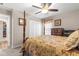 Bedroom with a four-poster bed, carpet flooring, closet, and warm, neutral wall colors at 13057 Sw 85Th Cir, Ocala, FL 34473