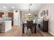 Dining room features a modern table set, with lots of natural light, seamlessly connecting to the kitchen at 13057 Sw 85Th Cir, Ocala, FL 34473