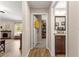 Hallway view featuring wood-look floors, connecting the living area to a bathroom and additional rooms at 13057 Sw 85Th Cir, Ocala, FL 34473