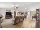 Open-concept living room with modern flooring seamlessly connecting to the dining area and kitchen at 13057 Sw 85Th Cir, Ocala, FL 34473