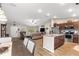 Inviting living area featuring a kitchen island, comfortable seating and a dining area with a wooden table and chairs at 13057 Sw 85Th Cir, Ocala, FL 34473