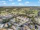 A beautiful aerial view of a meticulously planned community near a golf course and picturesque landscape at 13187 Se 93Rd Terrace Rd, Summerfield, FL 34491