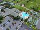 Aerial view of the clubhouse, pool, and ample parking, showcasing the community's amenities at 13187 Se 93Rd Terrace Rd, Summerfield, FL 34491