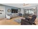 Nicely staged living room showcasing a media center, modern decor, and comfortable seating at 13187 Se 93Rd Terrace Rd, Summerfield, FL 34491