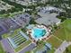 Aerial view of a community clubhouse and pool area, showcasing the recreational amenities available at 13187 Se 93Rd Terrace Rd, Summerfield, FL 34491