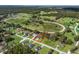 Aerial view of the property highlighting its location near a horse racing track and other residences at 14605 Sw 20Th Pl, Ocala, FL 34481