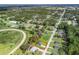 Aerial view of the property showing its generous lot size and proximity to wooded areas and a track at 14605 Sw 20Th Pl, Ocala, FL 34481