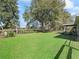 Expansive backyard with mature trees and lush lawn, perfect for outdoor activities and relaxation at 14605 Sw 20Th Pl, Ocala, FL 34481