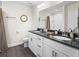 Well-lit bathroom with a double vanity, granite countertop, white cabinets, and a shower-tub combination at 14605 Sw 20Th Pl, Ocala, FL 34481