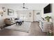 Cozy living room featuring a comfortable sofa, area rug, ceiling fan, and a stylish console table at 14605 Sw 20Th Pl, Ocala, FL 34481