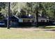 Spacious home exterior, includes porch, screen and yard at 18800 Sw 31St St, Dunnellon, FL 34432