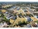 Neighborhood aerial view with mature landscaping, diverse home styles and winding roads at 2032 Se 27Th Rd, Ocala, FL 34471