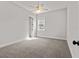 Bedroom featuring plush carpeting, a ceiling fan, and walk-in closet at 2032 Se 27Th Rd, Ocala, FL 34471