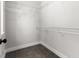 This closet features neutral walls and carpet, and white wire shelving at 2032 Se 27Th Rd, Ocala, FL 34471